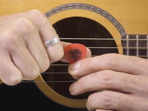 thumb-middle-of-pick Thumb on the back of the pick, in the middle.